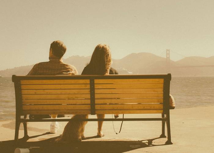 couple on bench near sea