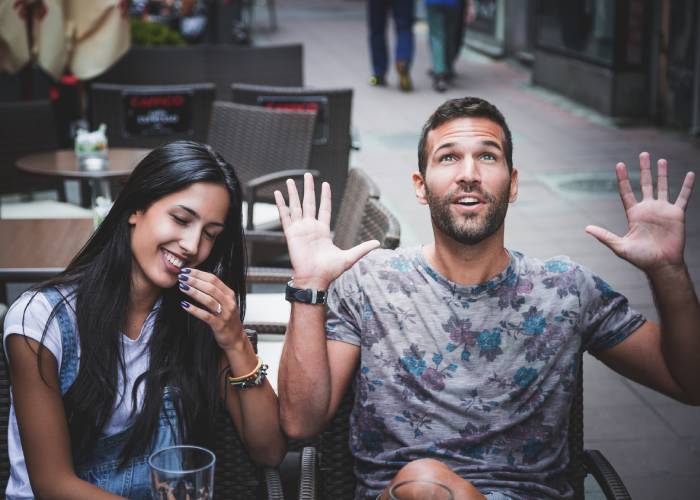 A guy and a girl sitting at a table